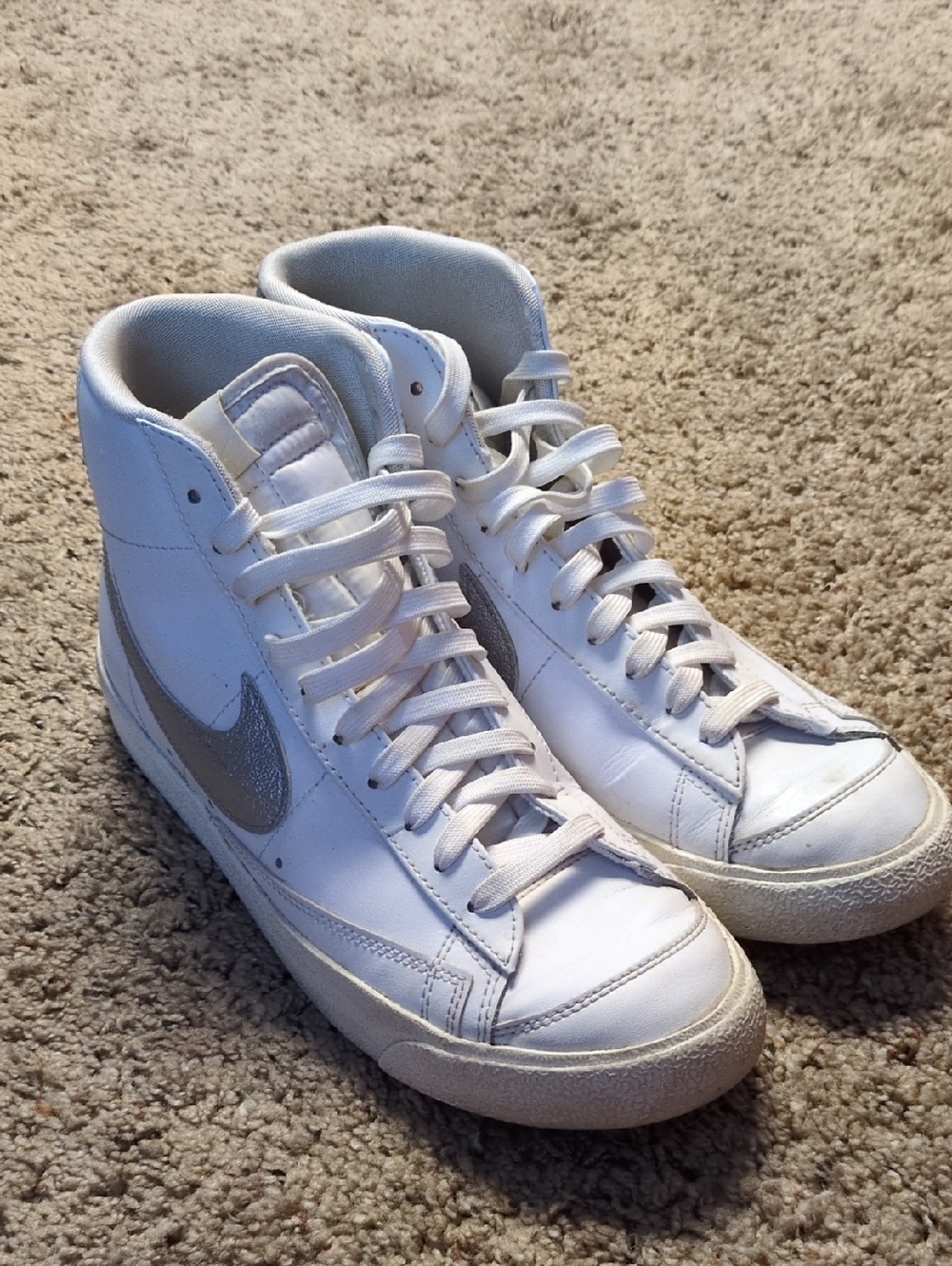 Nike White High-Top Sneakers with Silver Swoosh Accent